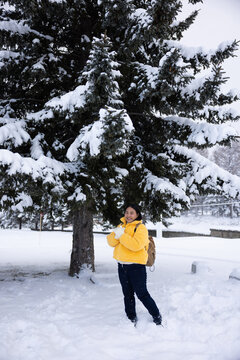 Portrait Beautiful asian fat woman smile happy travel and enjoy with snow winter season. Wearing thick coat, Snowy landscape surrounds, Joyful winter moment, perfect for family scenes. Vacation