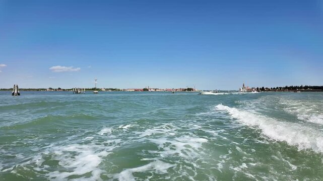 A view of the lagune of Venice with Murano in the background from a vaporetto water bus.