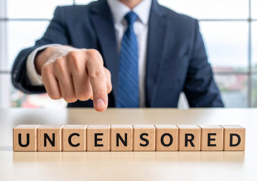 uncensored - Geschäftsmann zeigt auf das Wort "uncensored"
