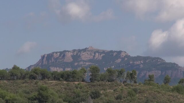Mountain peak La Mola Sant Llorenc pine trees countryside nature day sunlight