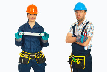 Fototapeta premium Two workers stand side by side, smiling confidently