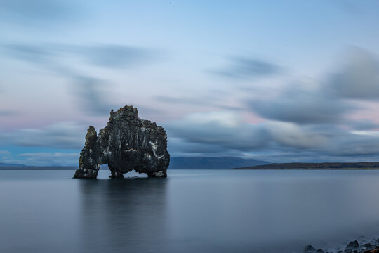 Rock formation in the middle of the water, Hvitserkur, Northern Iceland, long exposure motion blur