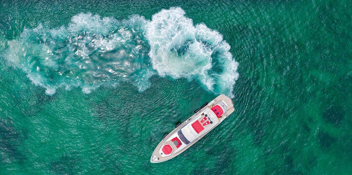 Motor yacht luxury vessel. Boat motor aerial. Vacation on summer. Aerial view motorboat. Yacht boat tour. Luxury boat yachting. Motorboat sailing at sea. Luxury private yacht in ocean
