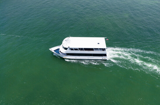 Motorboat sailing at sea. Luxury charter yacht in sea. Motor yacht luxury vessel. Sea motor boat. Sea summer vacation. Aerial motorboat. Yacht boat tour. Luxury boat yachting. Summer escape
