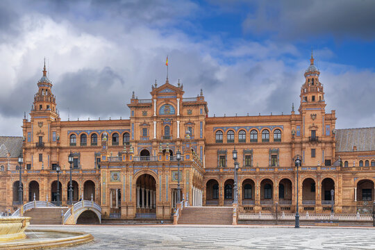 Central building of Plaza de Espana in Seville Spain with grand arches. Renaissance Revival architecture under cloudy sky