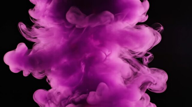 This shows a vibrant purple explosion of smoke with a fiery red center on a black background. The dramatic visual effect is perfect for adding energy and power to any production or creative project.