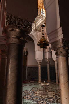 Moulay Ismail Mausoleum, Meknes, Morocco, featuring traditional Islamic architecture, ornate pillars, zellij tiles, and a central fountain
