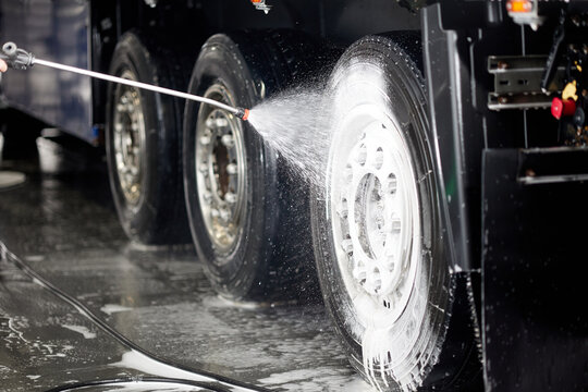 Professional cleaning of truck wheels and rims using high-quality foam and water services, ensuring a spotless shine. Perfect for automotive enthusiasts and detailing services.