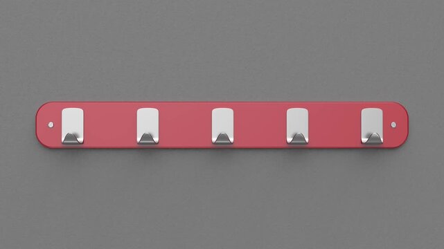 Red wall hanger on a grey wall