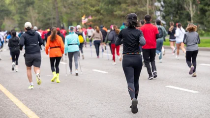 Diverse participants jogging and Nordic walking at Almaty Half Marathon 2026 © Abzal