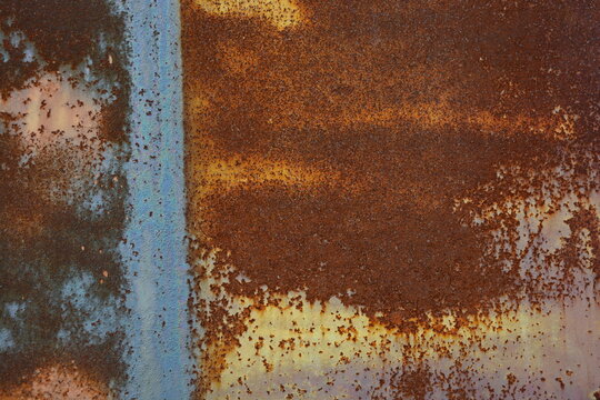 Things, unusual objects, old metal garage doors covered with very deep rust, red metal covered with corrosion, metal structures welded together.
