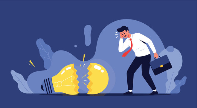 Stressed businessman looking disappointed and frustrated next to a large shattered light bulb representing a failed idea or business setback.