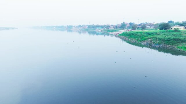 Environmental crisis establishing shot: Severe water pollution and habitat degradation at the Punpun and Ganges river confluence in India.