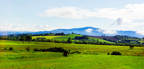 Obraz premium Panorama of the beautiful countryside of Italy. Wonderful spring landscape in the mountains.