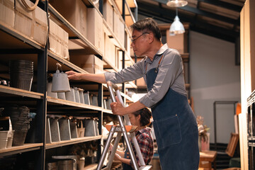 Shop shelf warehouse man ladder storage box container product retail inventory worker apron glasses...