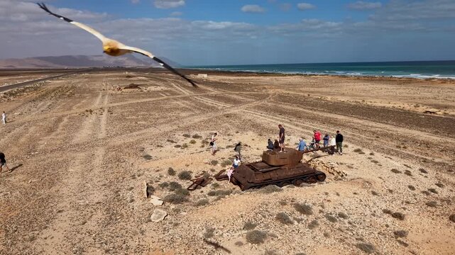 Rusted tank wreck on coastal desert plain. Sokotra, Yemen.