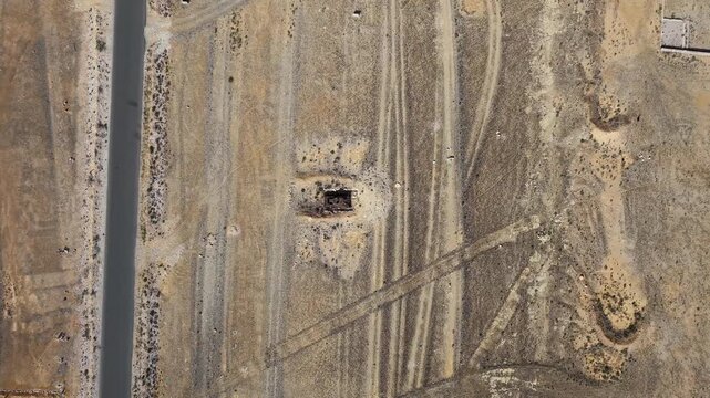 Aerial Desert Road with Dirt Tracks and rusted tank. Sokotra, Yemen.