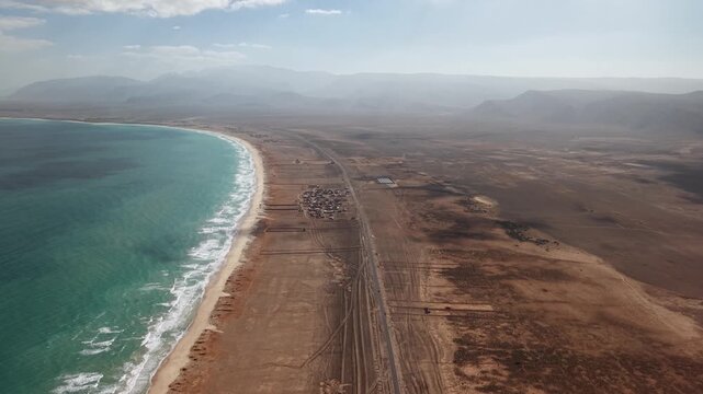 Drone aerial of desert coastline and turquoise ocean. Sokotra, Yemen.