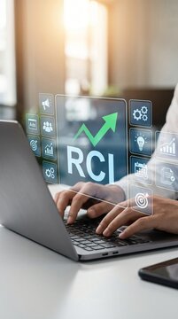 Businessman working on laptop with digital rci growth chart and business icons overlay