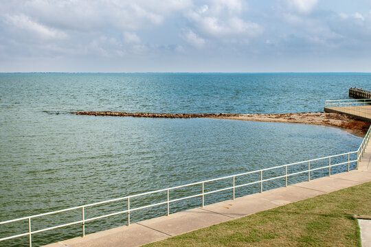Sidewalk leading to a pier on the Gulf of Mexico in Texas