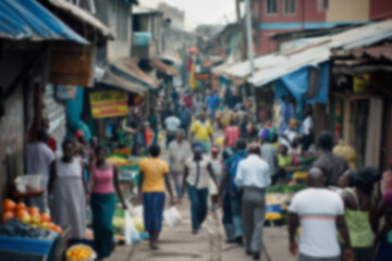 Fototapeta premium A blurred, candid shot of a busy outdoor market street filled with a diverse crowd of people walking