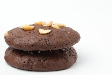 Fototapeta premium Tasty chocolate cookies with hazelnuts isolated on white