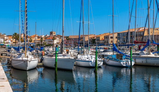 Boats and sailboats in the port of M&egrave;ze on the Thau Lagoon, in Occitanie, France