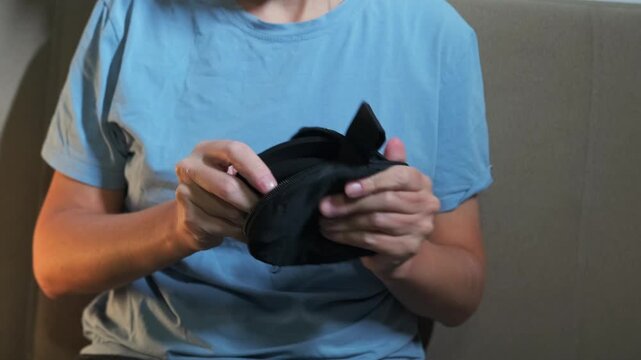 Woman taking white balance target from case and showing it, preparing color calibration tool for accurate photography and video shooting, professional workflow and equipment setup