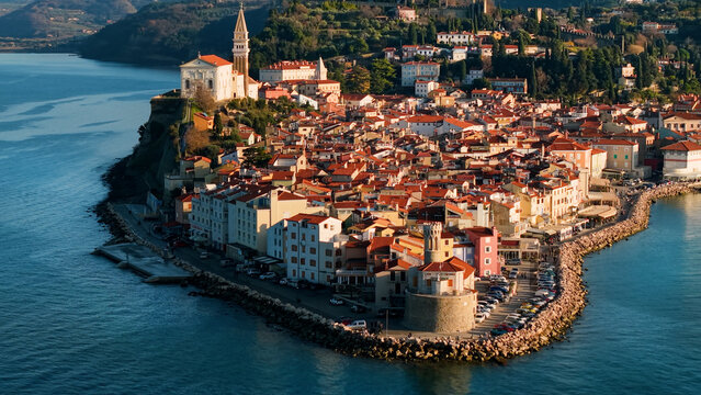 Piran Slovenia Peninsula Tip: Close-up of Cape Madona Lighthouse and Historic Town Center, Venetian Architecture on the Adriatic Sea Coast, Mediterranean Aesthetics 70mm Perspective 4K