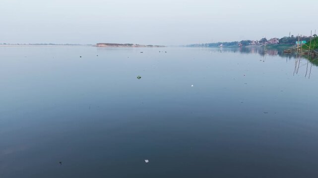 Severe habitat degradation and water pollution at the Triveni Ghat river confluence. Highly endangered Gangetic dolphin struggling to survive, feed in the heavily polluted waters of the River Ganga.