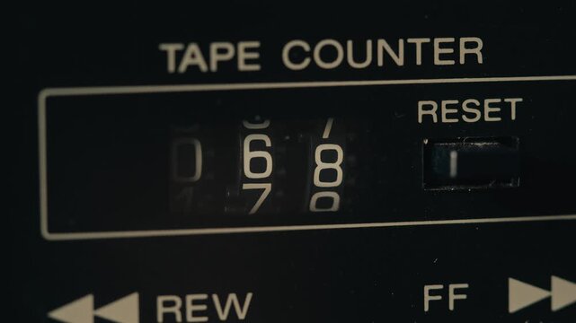 Retro radio tape recorder, audio cassette close-up. Listening to music, old radio boom box player, macro of vintage music listening. 