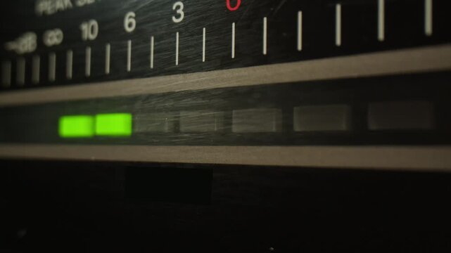 Retro radio tape recorder, audio cassette close-up. Listening to music, old radio boom box player, macro of vintage music listening. 