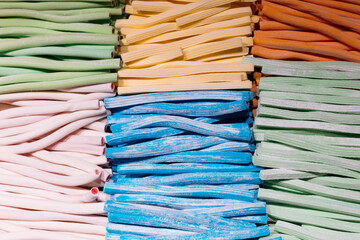 Assorted colorful licorice ropes and jelly string candies in a sweet shop. © sav_an_dreas