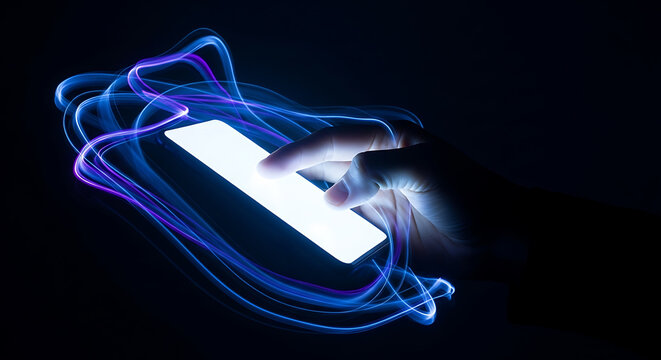 Hand touching glowing smartphone screen with blue and purple light trails