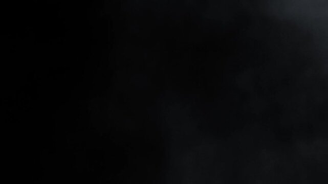 Steam, smoke, vapor isolated on black background. Smoke steam spray, abstract vaporing water, texture of cold mist, hot vapor, fog effect closeup, black screen. Hot food, drink. Slow motion