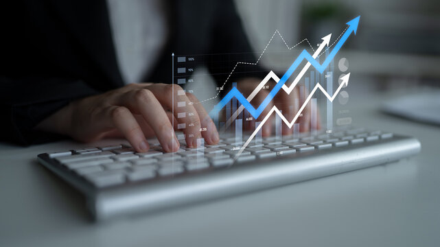 A business professional engages with a laptop, surrounded by digital graphics that depict growth trends and financial symbols in a sleek office environment. Scalp