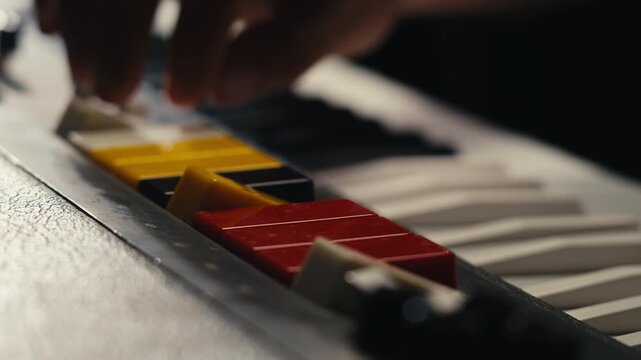 Playing piano vintage retro synthesizer. Close up of man hands playing jazz on the piano. Fingers on the piano, vintage colors. A very close look at a jazz pianist hands. Man playing the piano, close