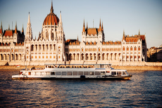 View of the Parliament building seen from the Danube river in the evening in Budapest, Hungary.