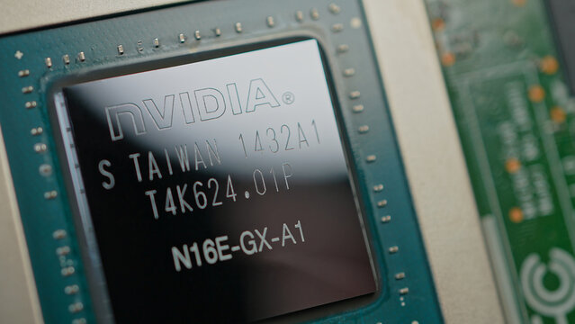 NVIDIA GPU design macro close up chip. High performance GPU semiconductor combine thousands CUDA to accelerate graphics and AI general purpose computation: Toronto, Ontario, Canada - March 24, 2026