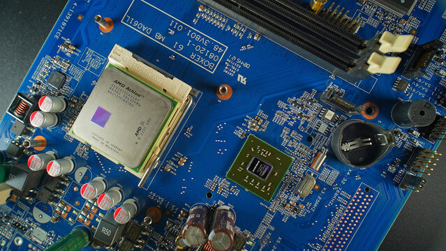 AMD CPU on motherboard top down view, concept of semiconductor and microchips shortage along with sanctions, critical mineral embargo and rear earth mining: Toronto, Ontario, Canada - March 24, 2026
