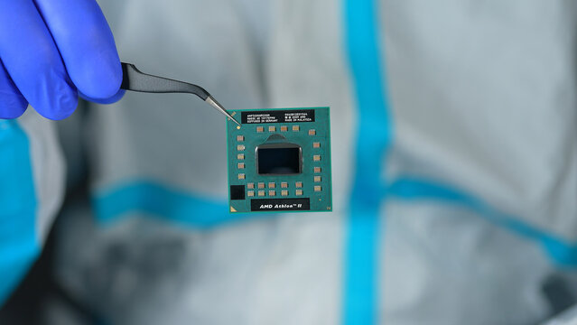 AMD CPU Central Processing Unit of the computer in the hand of engineer. Concept of AI boom triggered shortage of CPUs, components for data centers: Toronto, Ontario, Canada - March 24, 2026