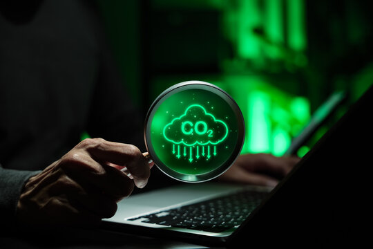 CO2 Emissions Reduction and Carbon Footprint Analysis Concept Magnifying glass over CO2 icon representing carbon monitoring, sustainability, decarbonization strategy, climate reporting, ESG management