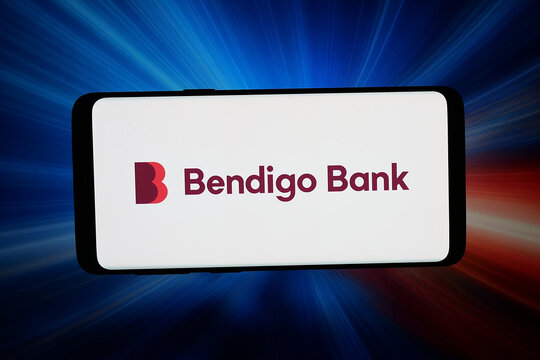 Stuttgart, Germany - 04-16-2026: In this photo illustration, the logo of company Bendigo and Adelaide Bank Limited is displayed on a smartphone in front of abstract background on computer screen.