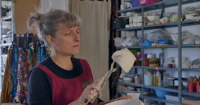 Artisan's Atelier: Capturing the meticulous craft of an artisan at work within the sunlit confines of a personal atelier. 