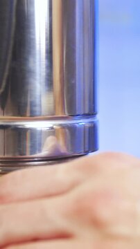 Closing the coffee espresso maker close-up in slow motion