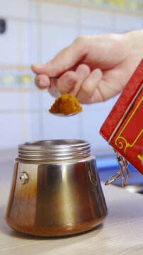 Adding coffee in espresso coffee maker slow motion