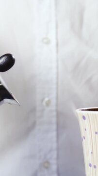 Clumsy morning person pour coffee next to cup slow motion