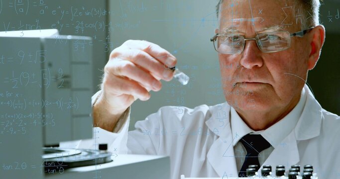 Inspecting scientist holding glass vial at bench with equations on glass, lab coat, tie, copy space
