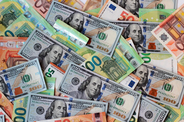 American hundred-dollar bills were designed alongside the euro bills.Money background © Gulsen