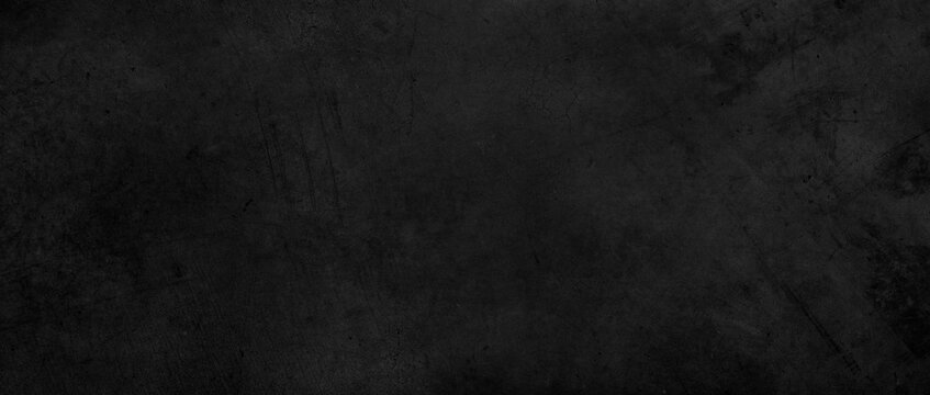 Dark grey textured concrete wall black background